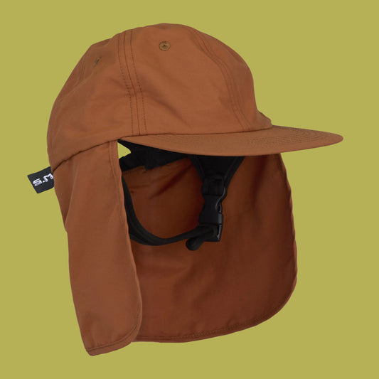 Brown cap with neck flap on a white background