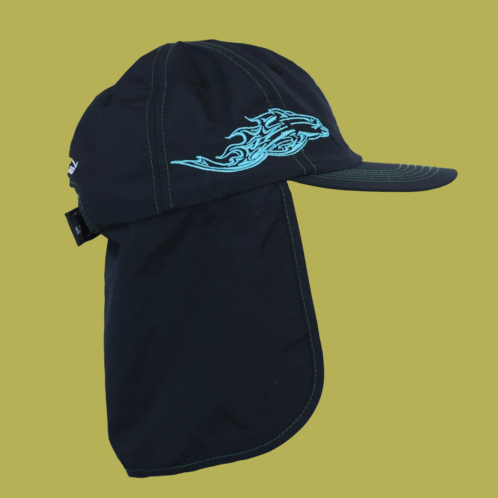 Black cap with a blue flame design on a white background